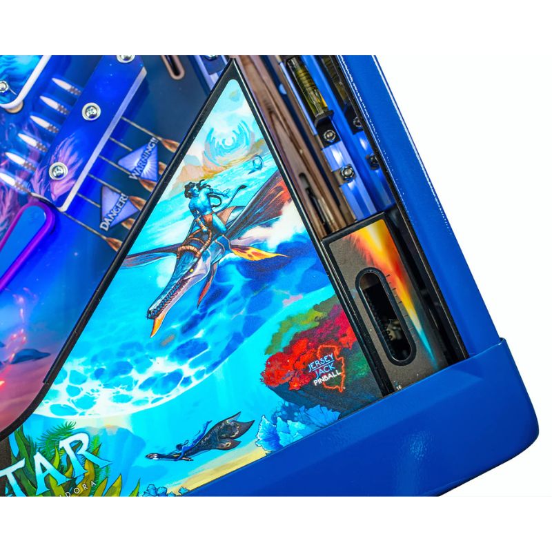 Close-up of a colorful pinball machine with vibrant graphics and blue casing.