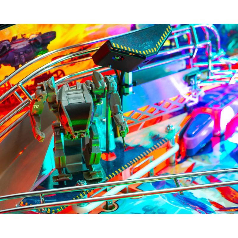 Close-up of a colorful pinball machine with vibrant lights and mechanical components.