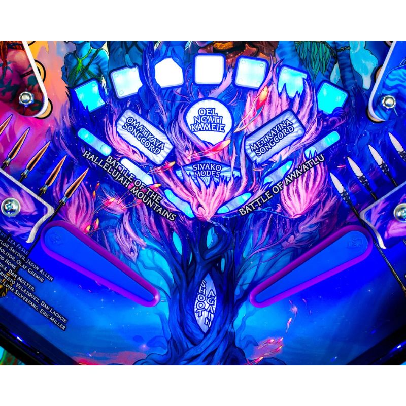 Close-up of a colorful pinball machine with intricate designs and text.