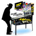 Pinball machine with '327 Games' branding and a person silhouetted beside it.