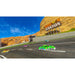 Desert landscape with a 'Canyon' sign and  cars on a road.