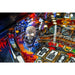 Close-up of a Metallica pinball machine Playfield with a skull figure and colorful playfield.