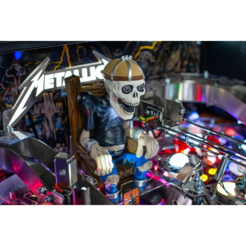 Metallica Pinball machine with a skeleton figure named sparky playing guitar and 'Metallica' branding.