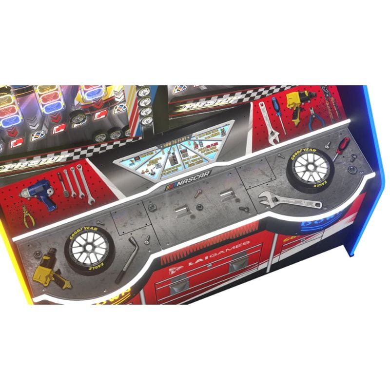 Close-up of a NASCAR Pit Stop arcade machine with detailed design elements on a white background