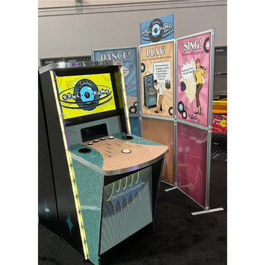 Vintage-style arcade machine with colorful posters on a gray background