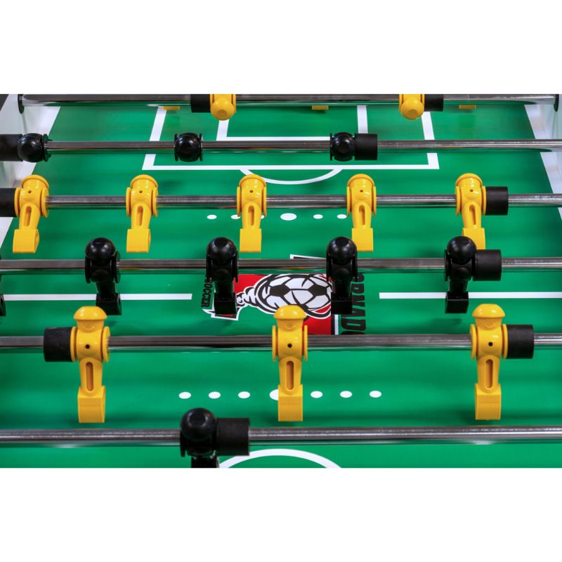 Close-up of a Tornado Classic foosball table with green playing surface and yellow and black players.
