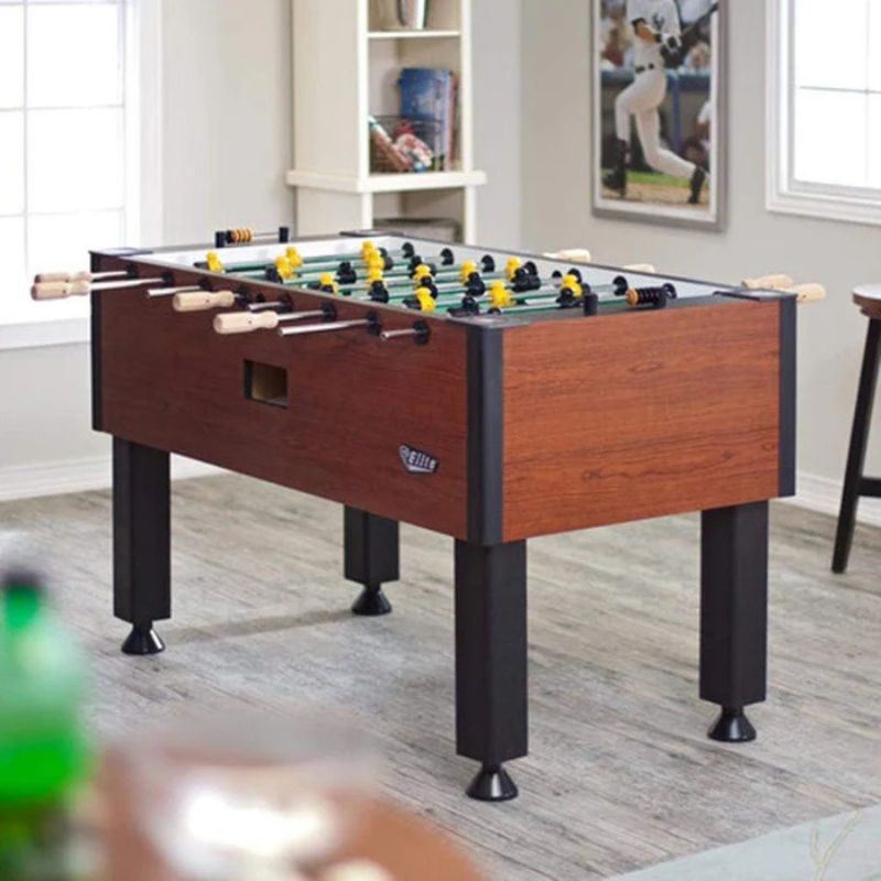 Tornado Elite Foosball table in a room with a sports-themed decor