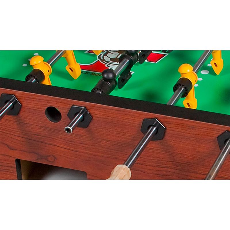 Close-up of a Tornado Elite  foosball table with players and green playing surface