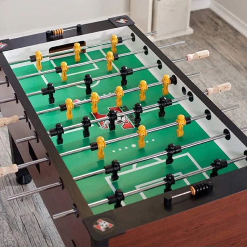 Tornado Elite Foosball table with green playing surface and red and white accents on a wooden floor.