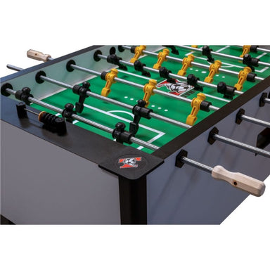 Close-up of a Tornado Elite foosball table with green playing surface and metal rods.