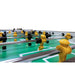 Close-up of a Tornado foosball Sport table with yellow and black players on a white background