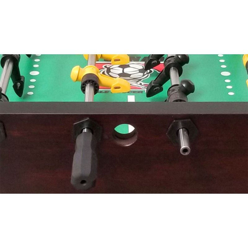 Close-up of a Tornado Venetian foosball table with player rods and a green playing surface.