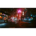 Neon-lit street scene with futuristic buildings and signs in a cyberpunk style.