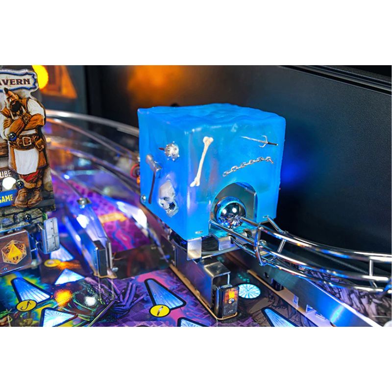 Close-up of a  d and d pinball machine with a blue and silver playfield feature.