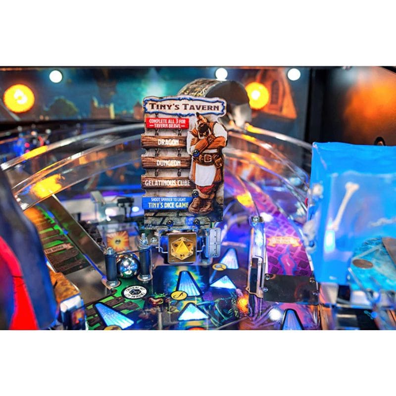 Pinball machine with 'Tiny's Tavern' game packaging on a colorful playfield.