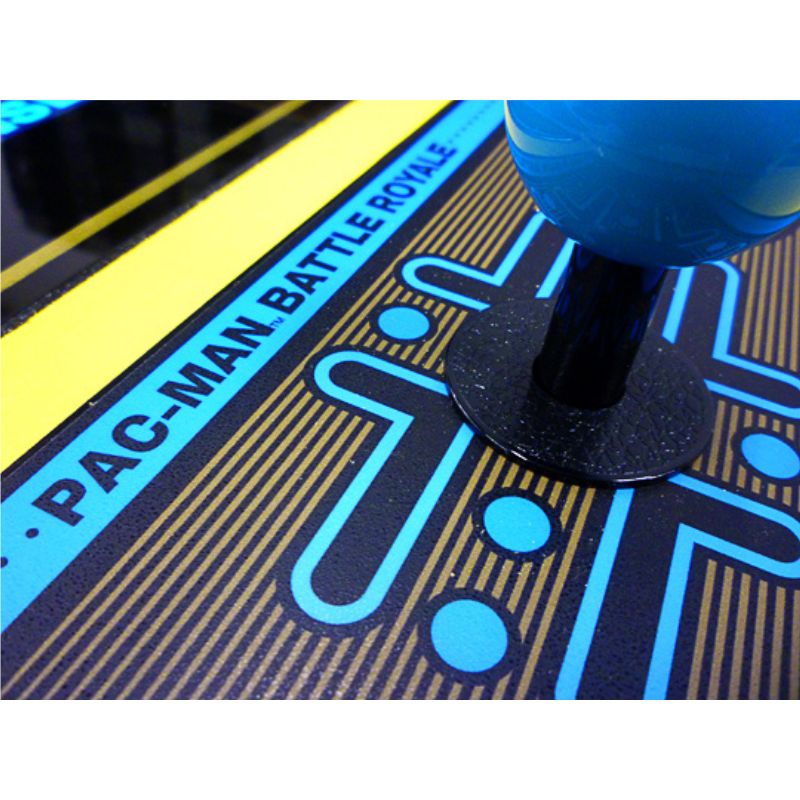 Close-up of a joystick on a Pac-Man Battle Royale game console.