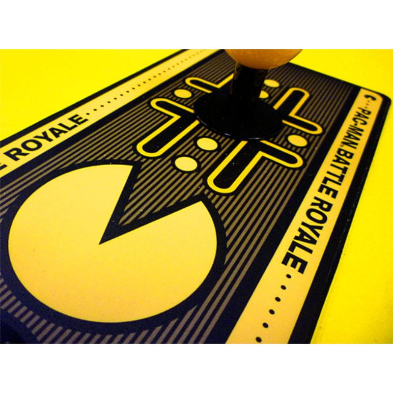 Close-up of a 'Pac-Man Battle Royale' game card with yellow and black design.